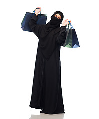 Image showing muslim woman in hijab with shopping bags