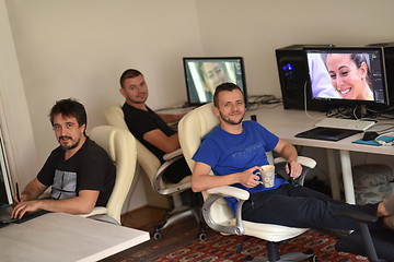 Image showing a group of graphic designers at work