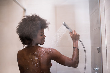 Image showing African American woman in the shower