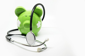 Image showing Piggy bank and stethoscope