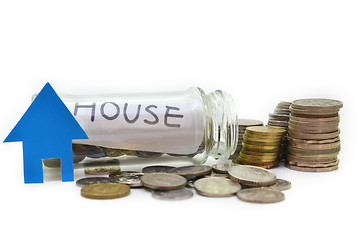 Image showing House model and stacks of coins