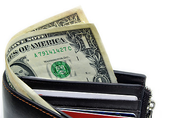 Image showing Money sticking out of a leather wallet