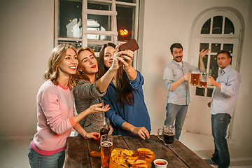 Image showing Group of friends girls making selfie photo