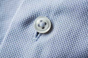 Image showing close up of blue shirt button