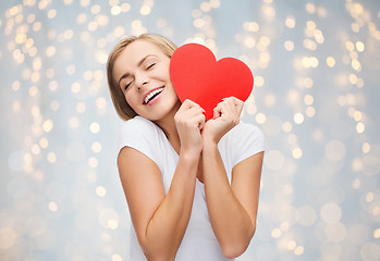 Image showing happy woman or teen girl with red heart shape