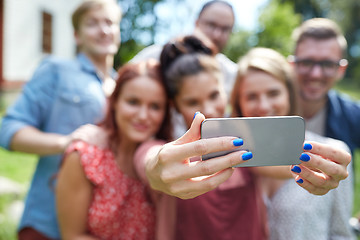 Image showing friends with smartphone taking selfie at summer