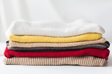 Image showing close up of stacked knitted clothes