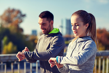 Image showing couple running over city highway bridge