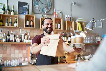 Image showing man or waiter serving customer at coffee shop