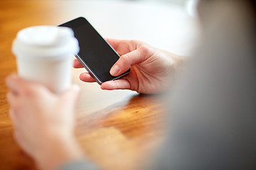 Image showing close up of woman with smartphone and coffee