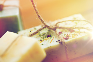 Image showing close up of handmade soap bars on wood