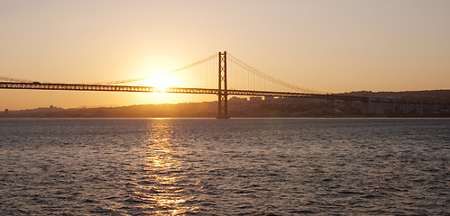 Image showing Bridge 25 de Abril on river Tagus at sunset, Lisbon, Portugal