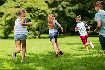 Image showing group of happy kids or friends playing outdoors