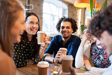 Image showing happy friends drinking coffee at restaurant