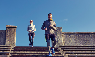 Image showing happy couple walking downstairs on stadium