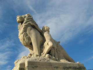 Image showing lion and child statues