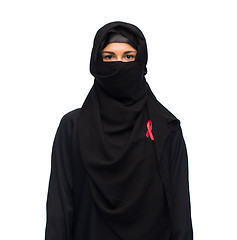 Image showing muslim woman in hijab with red awareness ribbon