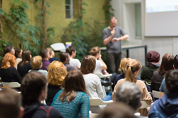 Image showing Man giving presentation in lecture hall at university.