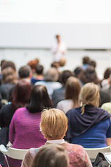 Image showing Woman giving presentation in lecture hall at university.