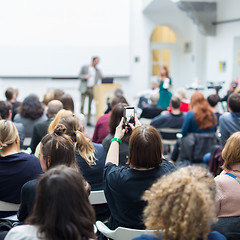 Image showing Man giving presentation in lecture hall at university.