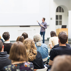 Image showing Man giving presentation in lecture hall at university.