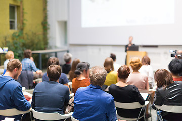 Image showing Woman giving presentation in lecture hall at university.