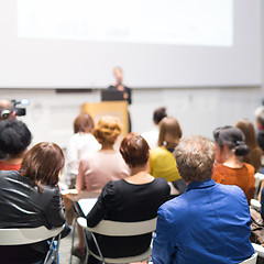 Image showing Woman giving presentation in lecture hall at university.