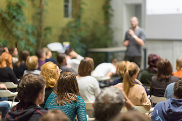 Image showing Man giving presentation in lecture hall at university.