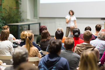 Image showing Woman giving presentation in lecture hall at university.