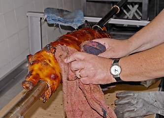 Image showing Preparation of roasted pork, a traditional Portuguese recipe, Lisbon, Portugal