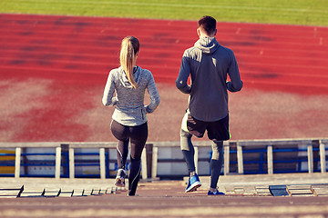 Image showing couple walking downstairs on stadium