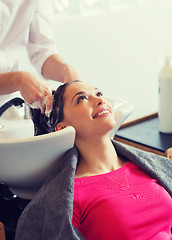 Image showing happy young woman at hair salon