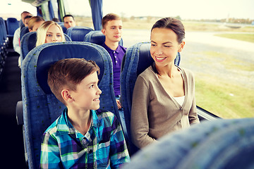 Image showing happy family riding in travel bus