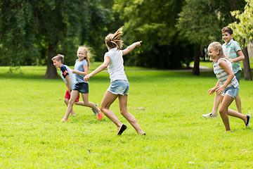 Image showing group of happy kids or friends playing outdoors