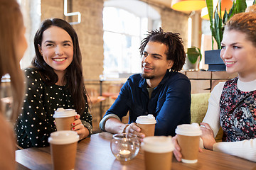 Image showing happy friends drinking coffee at restaurant