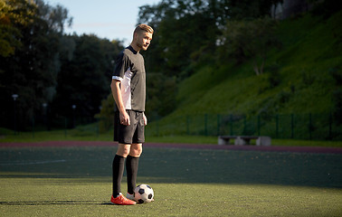 Image showing soccer player playing with ball on football field