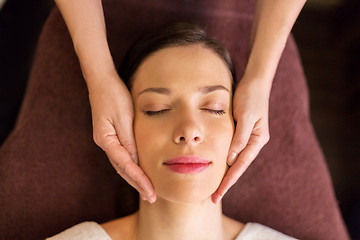 Image showing woman having face and head massage at spa