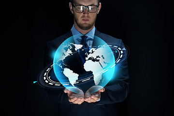 Image showing businessman with virtual earth projection