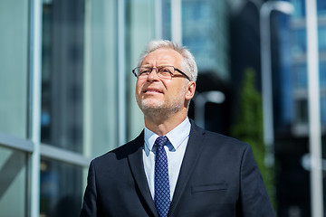 Image showing senior businessman on city street