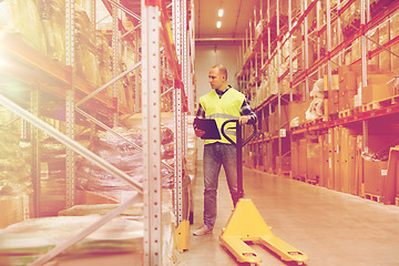 Image showing man with loader and clipboard at warehouse