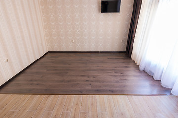 Image showing Zoning floor in the interior, ceramic tile smoothly into the living room laminate