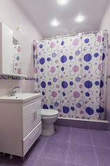 Image showing The interior of the bathroom, room with dressing room, shower curtain curtained