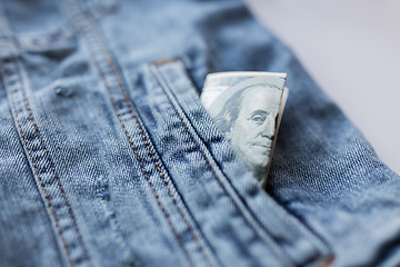 Image showing dollar money in pocket of denim jacket