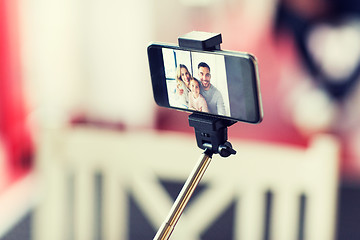 Image showing close up of happy family selfie on smartphone