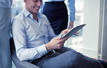 Image showing business team working with tablet pc in office