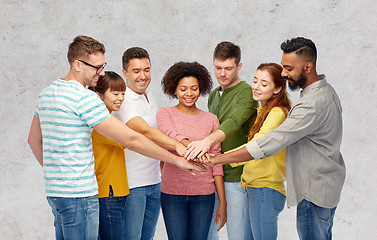 Image showing international group of happy people holding hands