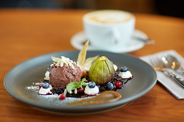 Image showing chocolate ice cream dessert on plate at restaurant