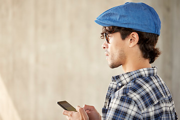 Image showing close up of man texting message on smartphone