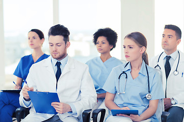 Image showing group of happy doctors on seminar at hospital