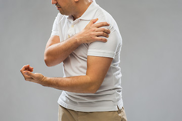 Image showing close up of man suffering from pain in hand